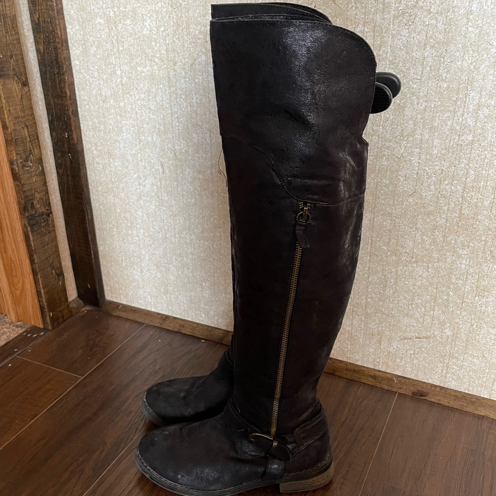 Restricted over the knee boots.
